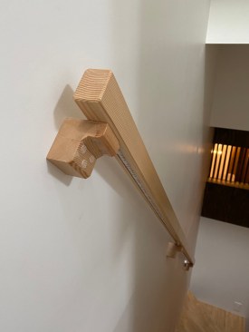 All solid wood stairs handrail detail. It incorporates an LED strip lighting on the underside.