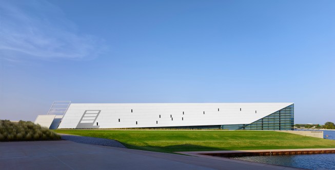 The west elevation illustrates the gold glass “notes” and the connection between rowing, fine art, and music.  Simply summarized as rhythm.  
