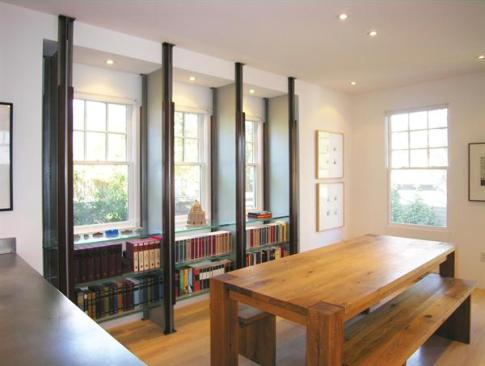 The shelving layout works within the existing scheme of windows and interior partitions