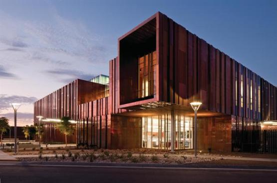 The copper rainscreen incorporates downspouts to manage water runoff, and it conceals the structure that supports the building?s lateral loads.