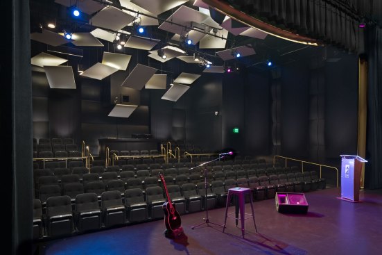 The intimately sized sound stage is used for the museum intro film as well as educational programs and concerts. The acoustic panels on the ceiling were inspired by scattered sheets of music.

