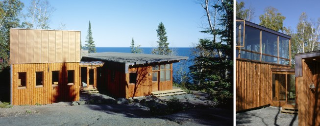 A glass walkway links two distinct structures of this Lake Superior cabin.