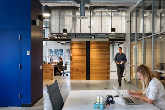 Interior view looking west from ground-floor open office into lobby