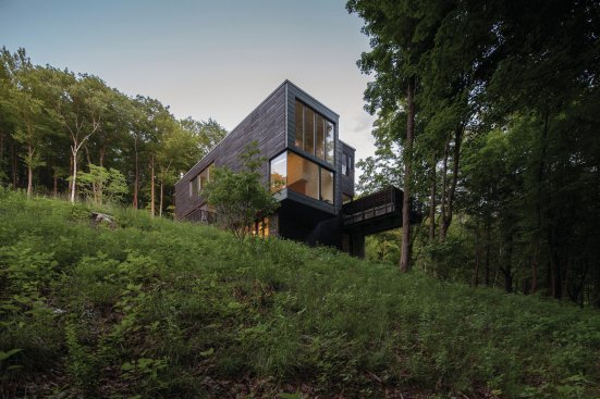 Exterior view showing cantilevered deck.