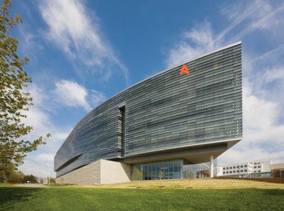 Aluminum curtain-wall system  Simmons Building  Products  Custom curtain-wall system  • Clear anodized aluminum structure  • Low-E insulated glazing units with a combination of Viracon clear vision and fritted glass  • Vertical structural glazed mullions with 4-inch-deep prefinished horizontal mullion covers  • Color of mullion covers matches metal panel system&nbsp;
