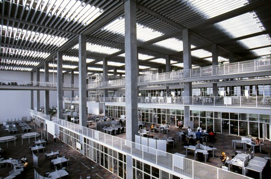 Designed by Riken Yamamoto, this research building at the Future University of Hakodate, Japan, is a collection of small, specialized spaces for research activities. Within the university’s departments for media architecture and department for complex systems, research groups (clusters) are formed across the borders of various research areas; the clusters are re-formed every few years. To adapt to the re-formation of clusters, rooms face each other with a laboratory in between.