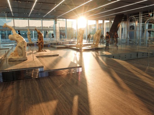 The ground-level gallery in the&nbsp;Fondazione's Plinth building, showing travertine platforms supported by clear acrylic.