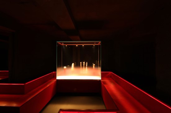 The display cases have a frosted glass treatment and give the appearance that the objects within are floating in a mist.
