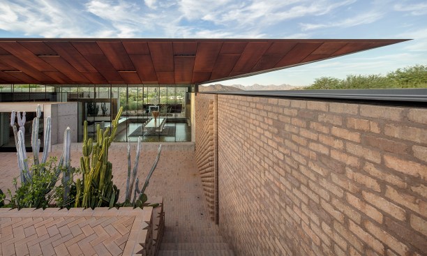As seen in the entry court, brick from Pacific Clay Manufacturers was used for the walls and sitework.