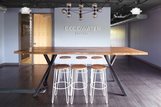 This live edge, elm table with blackened steel legs was custom made for Goodwater Capital.