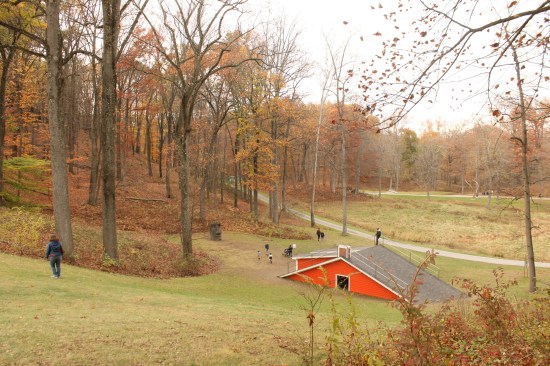 Heather Hart's 12-foot-wide by 67-foot-long  by 20-foot-tall "The Oracle of Lacuna" constructed with wood, tar, shingles, steel, and including an iPad and speakers at Storm King Art Center in New Windsor, N.Y. From the 2019 individual grant to Heather Hart for "Afrotecture (Re)Collection"