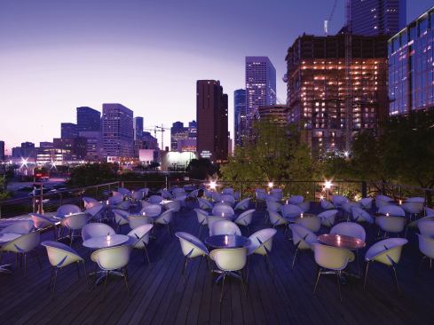 On the second-floor deck, patrons have a view of the Houston skyline—a reminder that despite the bucolic setting of the ground floor, the restaurant is in the heart of downtown. Plastic chairs and metal tables can withstand the region’s summer thunderstorms, and the view of Discovery Green is maintained by a minimal custom handrail that features stainless steel wire cables threaded through painted steel pipe.