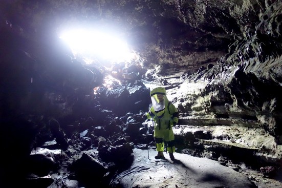 Exploring a cave formed in the lava fields of Mauna Loa.