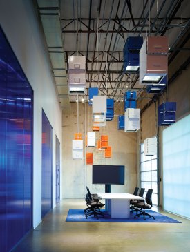 ImageNet, Carrollton, Texas, 2015 For one of ImageNet's recent offices, the architects used the company's corporate colors—blue and orange—to create distinct spaces, such as the cafe. The main conference room features a whimsical design element: a lighting installation made from repurposed filing cabinets suspended from the ceiling.