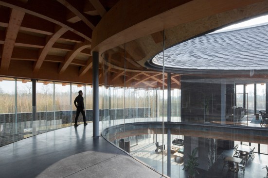 Rectangular structural steel tubes encased in wood boards encircle the inner and outer perimeters of the Inkstone House.