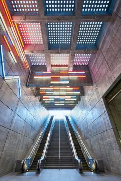 Light filters through sidewalk-level pavers.