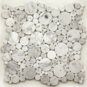 Marme Canada  One can picture the Bubbles Bianco Carrara tile lining the walls of a shower stall or kitchen backsplash—or pretty much anywhere near water. The tile comes as polished marble pieces mounted on a 12-inch-by-12-inch mesh.&nbsp;
www.marmecanada.com.