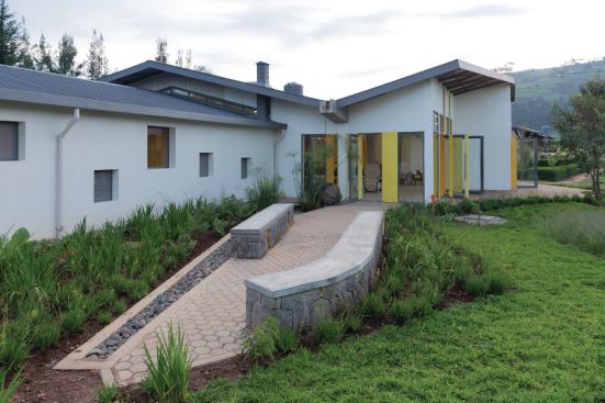 A pavered patio wraps the cancer center, providing outdoor space for patients and family members to congregate.