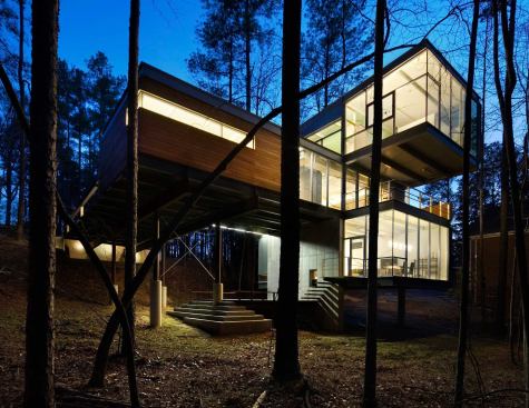 Jury Selections - Second Place: 1804 Pictou Road, Raleigh, N.C.  Architect/Builder: Mike Rantilla, AIA, LEED AP  Architect’s description:  The unique form of the building is a literal response to the significant site challenges. Wedged between zoning setbacks, a stream buffer, and a steep slope, the program massing was squeezed vertically into a three-story scheme. Each floor level is expressed as a discrete rectangular volume clad in a different material and spun radially from a 40-foot-tall, 18-inch-thick solid concrete shear wall. This articulation of the volumes creates a wide variety of habitable outdoor spaces. The height of the mostly transparent upper volume set within the forest canopy evokes the feeling of a tree house.  &nbsp;  Jurors’ comments:  This house works well on its forest hillside site, and must be a dramatic and wonderful place to live—a mixture of structural boldness and domestic intimacy. The house has a case study quality about it. As the case studies were often influential, we expect this building will be, too.