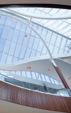 A—Skylights  Architectural Glazing Technologies 
agtglazing.com • Formerly known as the Architectural Skylight Co.  • Ball-and-socket hinge with a slope range of 15 degrees to 45 degrees simplifies installation  • Hidden fasteners provide uncluttered finished appearance  • In house custom design department for monumental skylights  B—Surface-mounted metal halide fixture  LSI 
lightingservicesinc.com • Ceramic metal halide lamps in fixtures mounted three on a track  • Uses less energy than fluorescent fixtures while still offering high light output  • Even distribution over the undulating ceiling plane ensures even light distribution across the space below  C—Interior latex paint  Benjamin Moore 
benjaminmoore.com • Several lines of interior latex paint in a variety of gloss levels  • Low-VOC options are available  • Full color spectrum allows for thousands of possible colors and tints  • Special enamels available for ceilings and trim