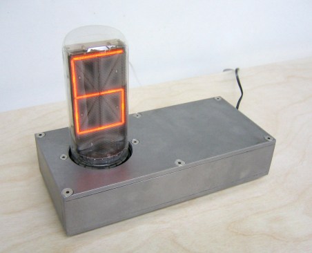 Made popular in the 1950s, Nixie tubes are electronic displays that predate LED technology. Awes programmed this one to function as a clock and added a simple steel-case stand.