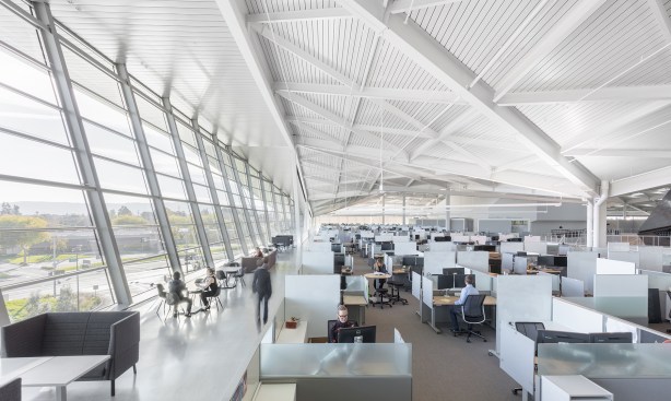 The uplights suspended from the structural beams throughout the project also help to mitigate high
contrast ratios, making the space visually comfortable and glare free.
