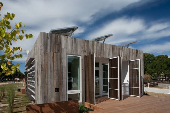 Ohio State’s Solar Decathlon house features cladding reclaimed from a local barn; glass on four sides brings in natural light.