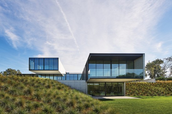 Two 27-foot cantilevered volumes contain the master suite (at left) and living room.