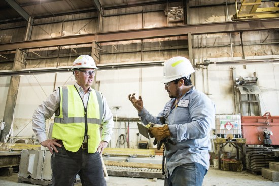 Smith listens to workers in the plant. “We want to be a place where people want to come to work.”
