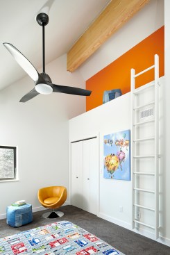 The three-bed-two-bath interior features light woods in contrast with the project’s dark façade. 