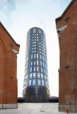 Tower with single-story connections to adjacent historic barracks
