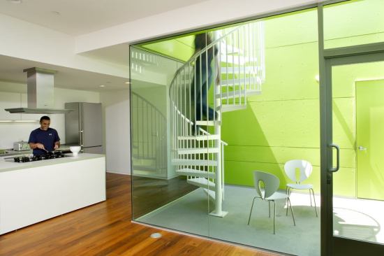 Scooped-out balconies and terraces supply private outdoor rooms.