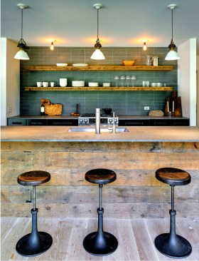 Salvaged
wood was used for the paneling and shelving of the renovated kitchen.