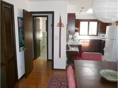 The original kitchen and common area were previously
enclosed, making it difficult to make a cohesive dining area.
