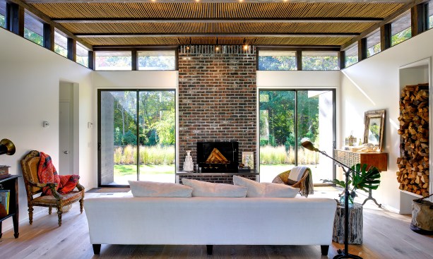 The
new living area is defined by furniture, with the new dining area facing it.