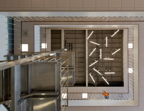Looking up toward the ceiling of the Ballard Hall to illustrate how the openness of the space assists with multi-level signing.