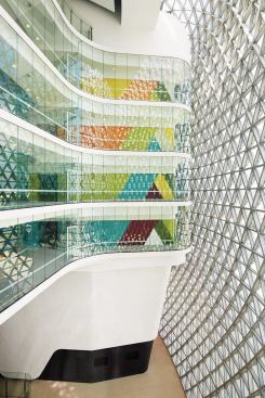 A narrow, open-air atrium on the west side of the building helps to regulate temperature and reduce heat gain in adjacent conditioned spaces.