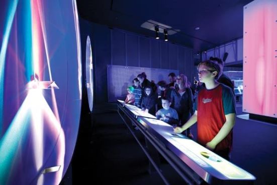 Light Behavior is both an exhibit about the principals of reflection and refraction, and a work of art. Based on the work of a Berlin-based light artist, this pair of interactive exhibits uses moving prisms of dichroic glass, rotating reflective surfaces, and mirrored cylinders to create patterns of light and color. The effect is not only beautiful, but demonstrates the behavior of reflected light.