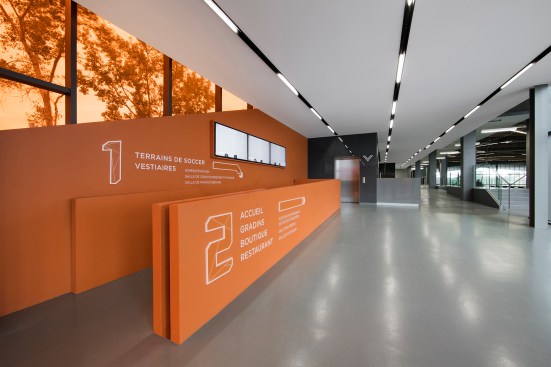 Second-floor hallway, with view to indoor field at right