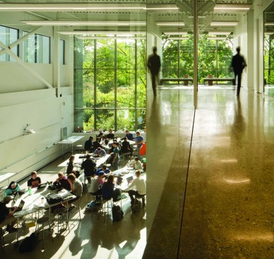 A lab space at the building’s northeast corner (at left) pairs ETFE-clad clerestory windows with full-height glazing. The double-height space is overlooked by a third-floor corridor (at right) and is designed to be flexible, accommodating different departments as they grow as well as new equipment for future research.
