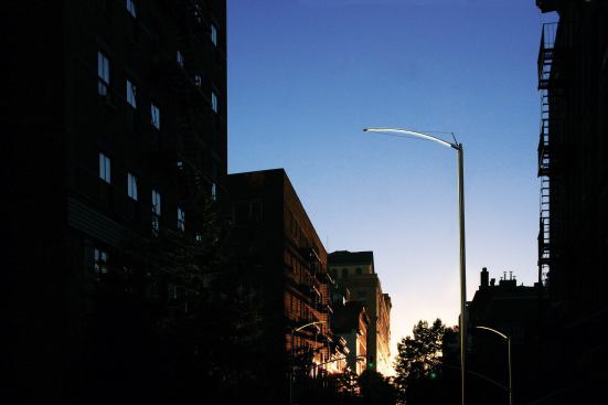 Light is also directed by the curved shape of the fixture's housing, one of the object's distinctive aesthetic features.