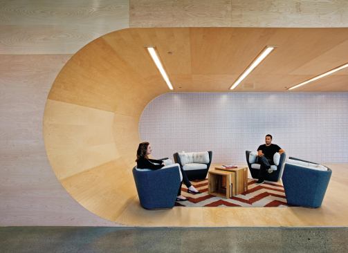 Details such as the wooden ceiling that curves down to form a seating cove (modeled after the skate board half-pipes that were all the rage when AOL was founded in the 1980s) are designed to serve as breakout spaces, giving incubatees a chance to meet and collaborate with those working on other projects.