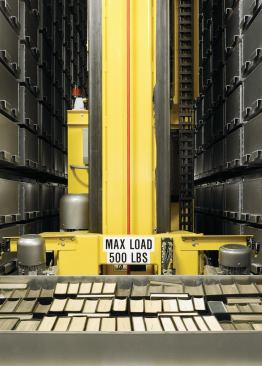 In book storage, which is a space that Jahn says has "a kind of sacred power," bins of books are retrieved via automated crane.