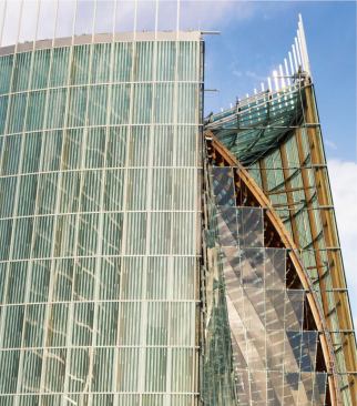 A fritted glass curtain wall forms the outer skin of the building along with the Alpha and Omega walls-the sculptural walls at either end of the space. High-performance glass was tested to make sure that it admitted enough light but didn't contribute to glare or heat gain.