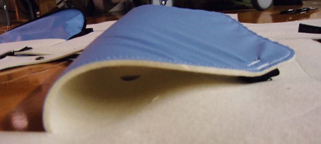 INTERIOR FELT "DRAPE"

Preliminary sketches for the felt drape system have been manufactured into large-scale mockups. There are voids in the felt to give access to the blue vapor barrier, and zippered pockets so that residents can actively use the surface for storage.