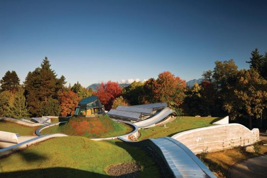 A conical skylight  punches though the roof of the visitor center’s lobby, and serves as a solar chimney to generate airflow in the naturally ventilated space. 