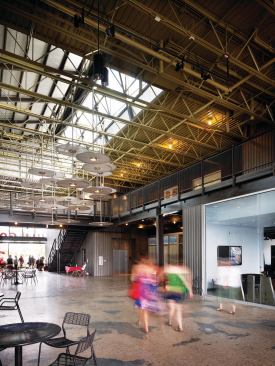 The nearly 64,000-square-foot building features a series of large breezeways that passively ventilate the structure and create interactive spaces.