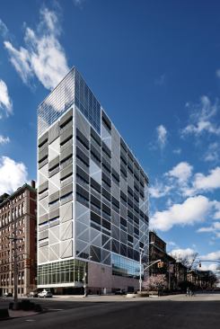 The façades (including the north and west, this image) incorporate extruded aluminum louvers and clear anodized aluminum panels.