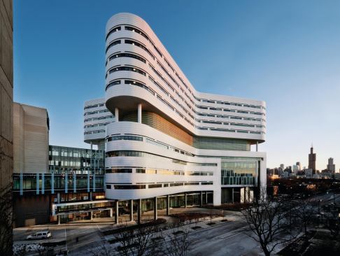 Viewed from the Rush University Medical Center campus, the curvilinear form of Perkins+Will’s new hospital tower extends, in part, down to the base of the structure. 
