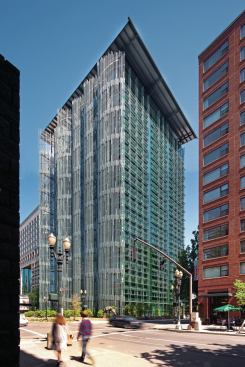The west façade is clad in a series of aluminum “reeds,” which shade the building from the strongest direct sun. The curtainwall from Benson Industries is more visible on the south façade, where fixed sunshades mitigate glare and solar gain.